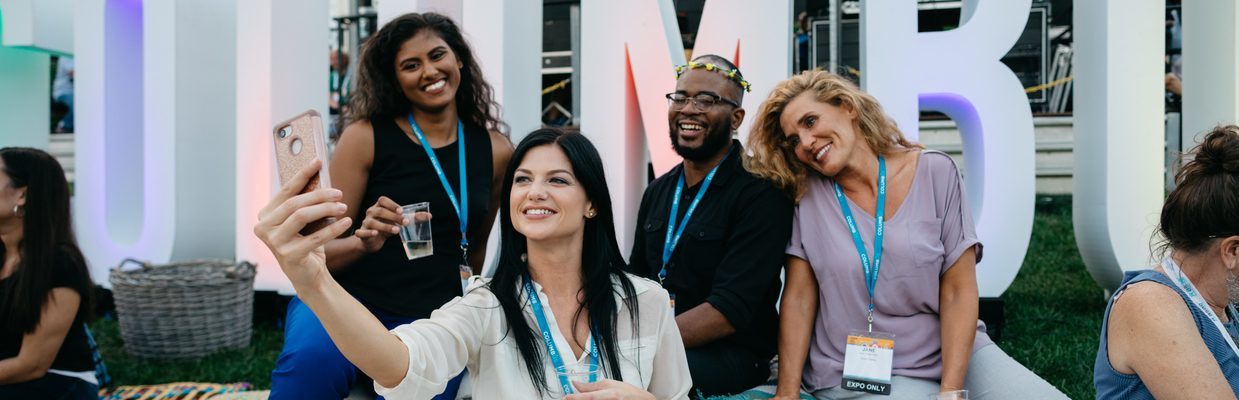 Group of meeting attendees taking a selfie