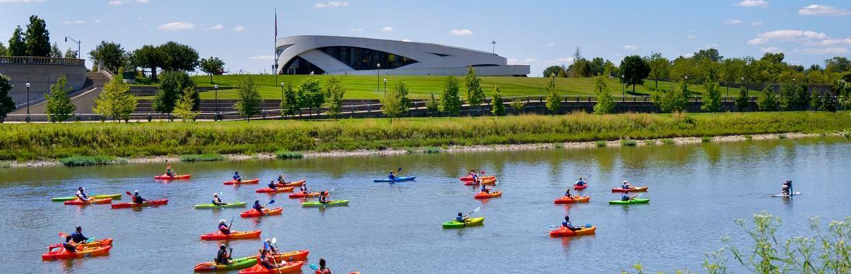 Kayaks on Scioto River with National Veterans Memorial and Museum in background